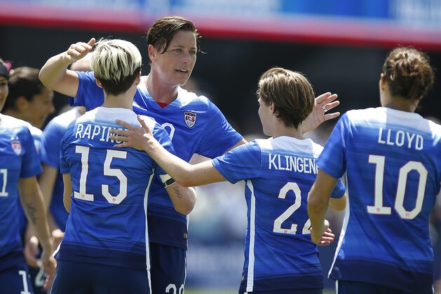 United States’ Abby Wambach, center, is congratulated by teammates after scoring a goal against Ireland during the first half of an exhibition soccer match Sunday, May 10, 2015, in San Jose, Calif. (AP Photo/Tony Avelar)