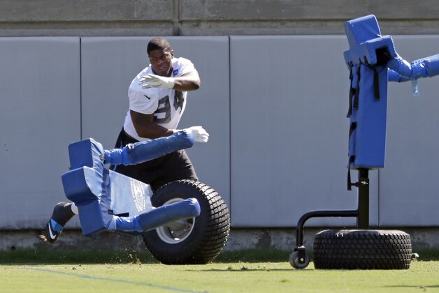Carolina Panthers' Kony Ealy (94) runs a drill during NFL football minicamp in Charlotte, N.C., Wednesday, June 17, 2015. The Panthers will rely on a young rotation of defensive ends to replace Greg Hardy, who was not re-signed this offseason as a free agent after the former Pro Bowl selection missed most of last season while dealing with a domestic abuse case. (AP Photo/Chuck Burton)