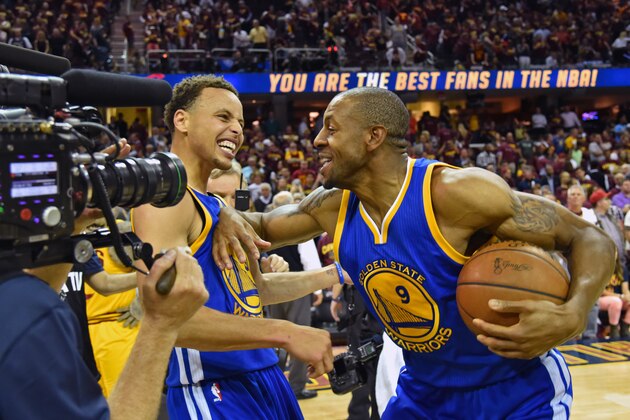 CLEVELAND, OH - JUNE 16:  Stephen Curry #30  and Andre Iguodala #9 of the Golden State Warriors celebrate after defeating the Cleveland Cavaliers in Game Six of the 2015 NBA Finals at The Quicken Loans Arena on June 16, 2015 in Cleveland, Ohio. NOTE TO USER: User expressly acknowledges and agrees that, by downloading and/or using this Photograph, user is consenting to the terms and conditions of the Getty Images License Agreement. Mandatory Copyright Notice: Copyright 2015 NBAE (Photo by Jesse D. Garrabrant/NBAE via Getty Images)