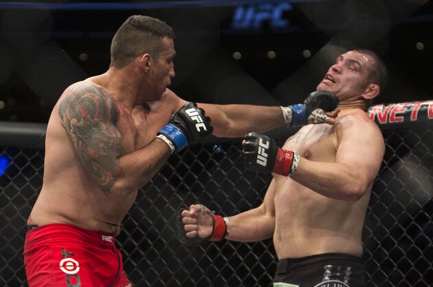 United States' Cain Velasquez, right, battles against Brazil's Fabricio Werdum during a men's heavyweight title mixed martial arts bout at UFC 188 in Mexico City, Saturday, June  13, 2015. Werdum won the fight by submission. (AP Photo/Christian Palma)