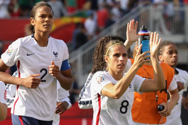 OTTAWA, ON - JUNE 17: Jessica Houara #8 and Wendie Renard #2 of France salute the fans after their win in the FIFA Women's World Cup Canada 2015 Group F match between Mexico and France at Lansdowne Stadium on June 17, 2015 in Ottawa, Canada.  (Photo by Andre Ringuette/Getty Images)