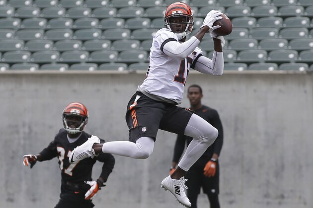 Cincinnati Bengals wide receiver A.J. Green, center, runs a drill during an NFL football minicamp at Paul Brown Stadium in Cincinnati, Wednesday, June 17, 2015. (AP Photo/John Minchillo)