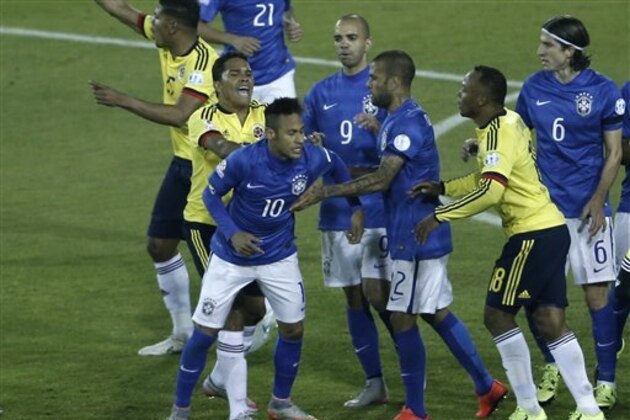 Colombia's Carlos Bacca, second left, pushes Brazil's Neymar, 10, during a scuffle at the end of a Copa America Group C soccer match at the Monumental stadium in Santiago, Chile, Wednesday, June 17, 2015. Colombia won the match 1-0.  (AP Photo/Silvia Izquierdo)