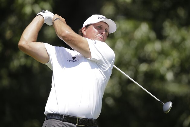 Phil Mickelson watches his drive on the seventh tee during the first round of the St. Jude Classic golf tournament, Thursday, June 11, 2015, in Memphis, Tenn. Mickelson made par on the hole. (AP Photo/Mark Humphrey)