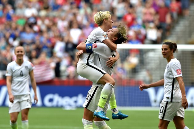 VANCOUVER, BC - JUNE 16:  Abby Wambach #20 of the United States celebrates with Megan Rapinoe #15 after Wambach scores a goal in the first half against Nigeria in the Group D match of the FIFA Women's World Cup Canada 2015 at BC Place Stadium on June 16, 2015 in Vancouver, Canada.  (Photo by Rich Lam/Getty Images)