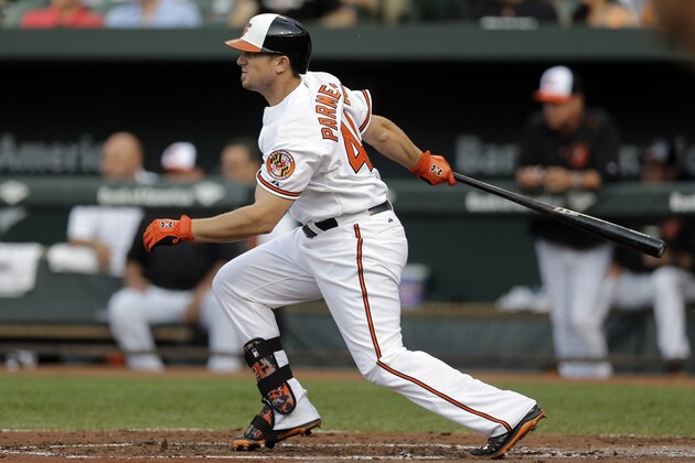Baltimore Orioles' Chris Parmelee singles in the first inning of an interleague baseball game against the Philadelphia Phillies, Tuesday, June 16, 2015, in Baltimore. (AP Photo/Patrick Semansky)
