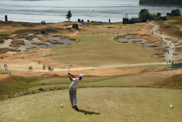 Alex Kim watches his tee shot on the fifth hole during a practice round for the U.S. Open golf tournament at Chambers Bay on Tuesday, June 16, 2015 in University Place, Wash. (AP Photo/Charlie Riedel)