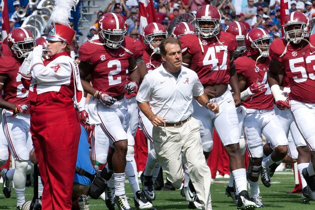 Sep 20, 2014; Tuscaloosa, AL, USA; Alabama Crimson Tide head coach Nick Saban brings his team onto the field prior to the game against the Florida Gators at Bryant-Denny Stadium. Mandatory Credit: Marvin Gentry-USA TODAY Sports