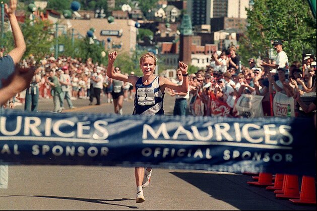 Irena Bogacheva, of Kirghizstan, raises her arms prior to crossing  the finish line to win the women's race for Grandma's Marathon on Saturday, June 21, 1997, in Duluth, Minn. Bogacheva finished unofficially at 2:38:45 and takes home a $7,000 first prize. (AP Photo/Duluth News-Tribune, Kathy Strauss)