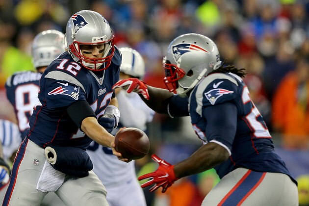 FOXBORO, MA - JANUARY 18:   Tom Brady #12 of the New England Patriots hands the ball off to  LeGarrette Blount #29 against the Indianapolis Colts of the 2015 AFC Championship Game at Gillette Stadium on January 18, 2015 in Foxboro, Massachusetts.  (Photo by Elsa/Getty Images)