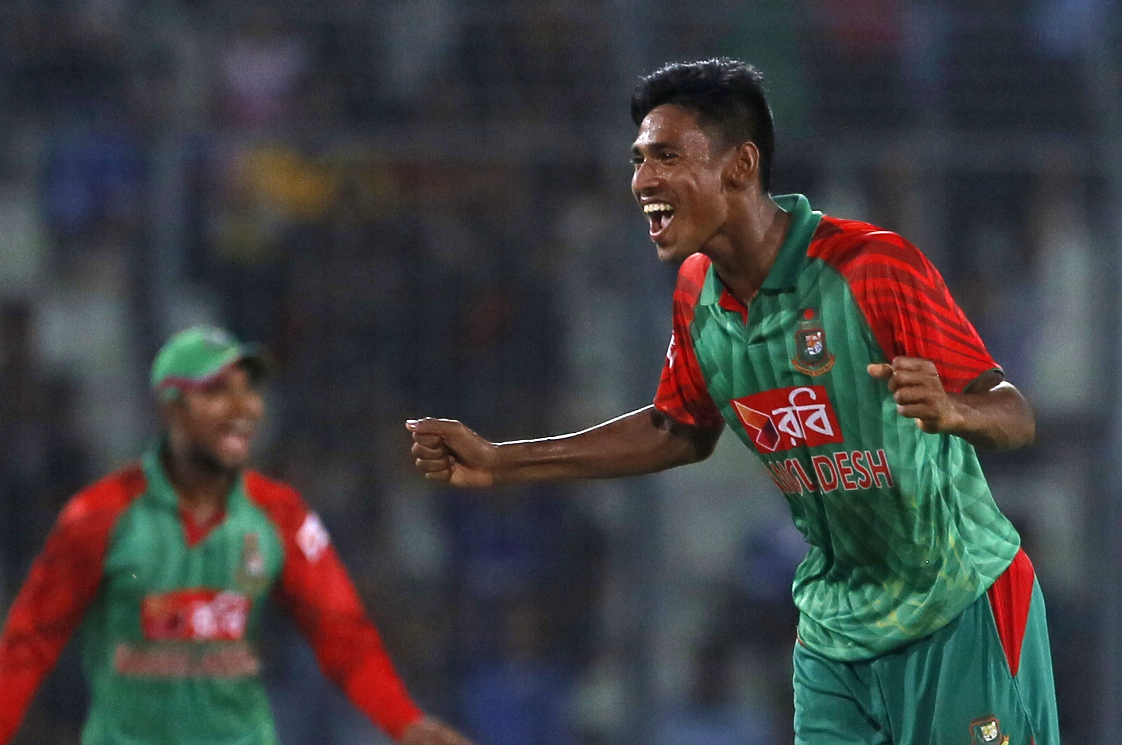 Bangladesh’s Mustafizur Rahman, right, celebrates the dismissal of India’s Rohit Sharma during the first one-day international cricket match between them in Dhaka, Bangladesh, Thursday, June 18, 2015. (AP Photo/ A.M. Ahad) Bangladesh’s Mustafizur Rahman, right, celebrates the dismissal of India’s Rohit Sharma during the first one-day international cricket match between them in Dhaka, Bangladesh, Thursday, June 18, 2015. (AP Photo/ A.M. Ahad)