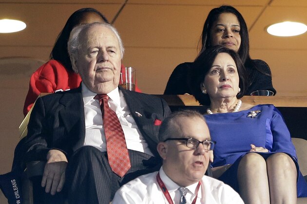 New Orleans Pelicans and New Orleans Saints owner Tom Benson, left, watches from his suite with his wife, Gayle Benson, during the first half of the Pelicans' NBA basketball game against the Denver Nuggets in New Orleans, Wednesday, Jan. 28, 2015. (AP Photo/Gerald Herbert)
