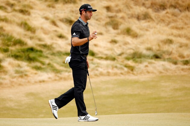 UNIVERSITY PLACE, WA - JUNE 18:  Dustin Johnson of the United States waves after making a putt on the seventh hole during the first round of the 115th U.S. Open Championship at Chambers Bay on June 18, 2015 in University Place, Washington.  (Photo by Ezra Shaw/Getty Images)
