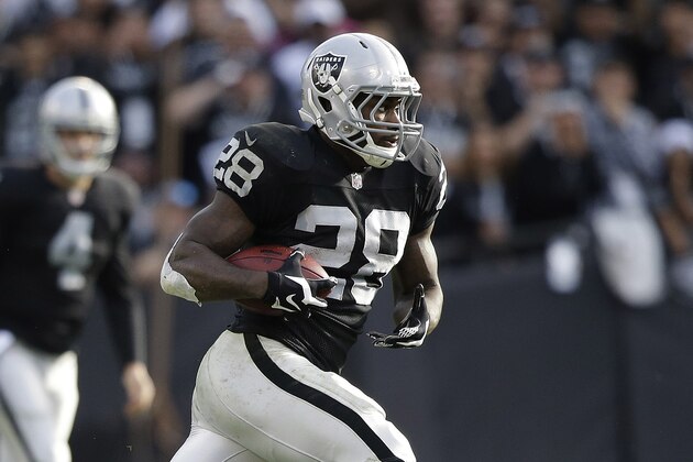 Oakland Raiders running back Latavius Murray (28) runs against the Buffalo Bills during the second quarter of an NFL football game in Oakland, Calif., Sunday, Dec. 21, 2014. (AP Photo/Marcio Jose Sanchez)