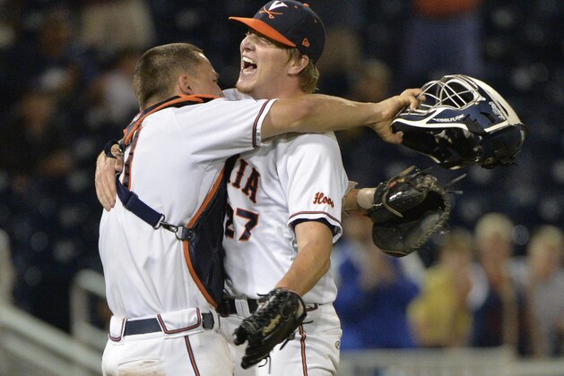 Virginia pitcher Josh Sborz (27) celebrates with catcher Matt Thaiss, left, after a 1-0 win over Florida in an NCAA College World Series baseball game at TD Ameritrade Park in Omaha, Neb., Tuesday, June 16, 2015. (AP Photo/Ted Kirk)