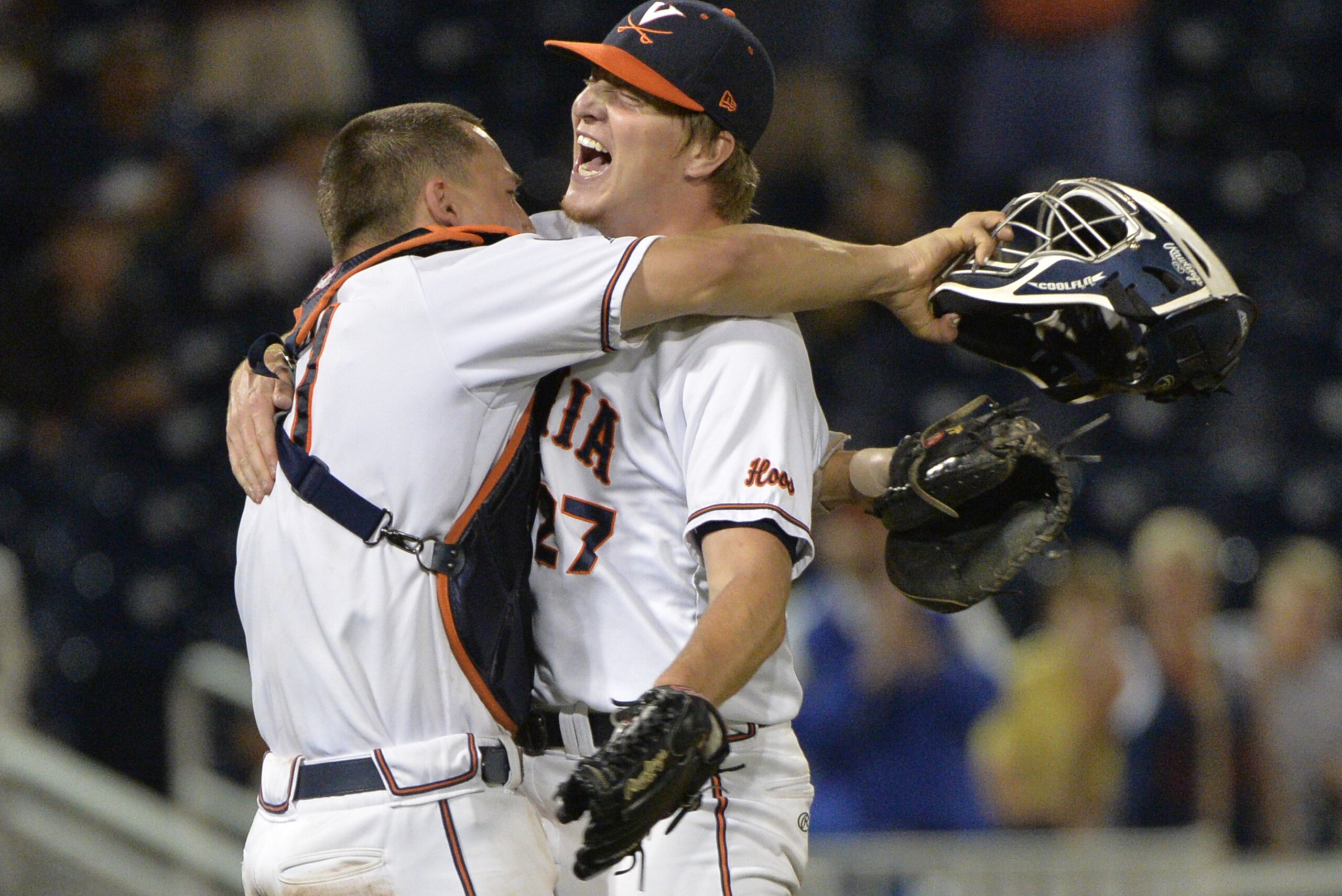 Virginia pitcher Josh Sborz (27) celebrates with catcher Matt Thaiss, left, after a 1-0 win over Florida in an NCAA College World Series baseball game at TD Ameritrade Park in Omaha, Neb., Tuesday, June 16, 2015. (AP Photo/Ted Kirk)