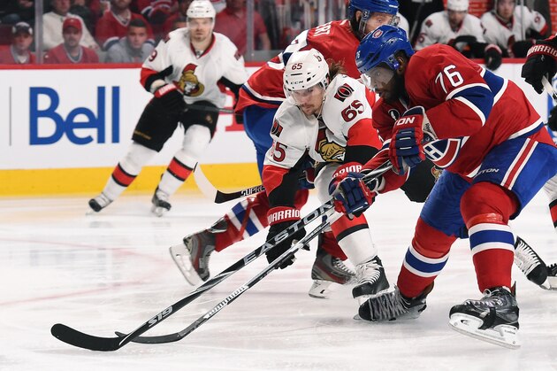 MONTREAL, QC - APRIL 17:  P.K. Subban #76 of the Montreal Canadiens and Erik Karlsson #65 of the Ottawa Senators battle for the puck in Game Two of the Eastern Conference Quarterfinals during the 2015 NHL Stanley Cup Playoffs at the Bell Centre on April 17, 2015 in Montreal, Quebec, Canada. (Photo by Francois Lacasse/NHLI via Getty Images)