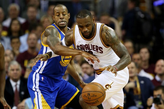 CLEVELAND, OH - JUNE 16:  LeBron James #23 of the Cleveland Cavaliers drives against Andre Iguodala #9 of the Golden State Warriors in the first quarter during Game Six of the 2015 NBA Finals at Quicken Loans Arena on June 16, 2015 in Cleveland, Ohio. NOTE TO USER: User expressly acknowledges and agrees that, by downloading and or using this photograph, user is consenting to the terms and conditions of Getty Images License Agreement.  (Photo by Ezra Shaw/Getty Images)