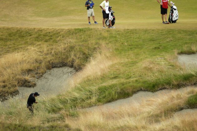 Dustin Johnson hits a chip on the ninth hole during the first round of the U.S. Open golf tournament at Chambers Bay on Thursday, June 18, 2015 in University Place, Wash. (AP Photo/Ted S. Warren) Dustin Johnson hits a chip on the ninth hole during the first round of the U.S. Open golf tournament at Chambers Bay on Thursday, June 18, 2015 in University Place, Wash. (AP Photo/Ted S. Warren)
