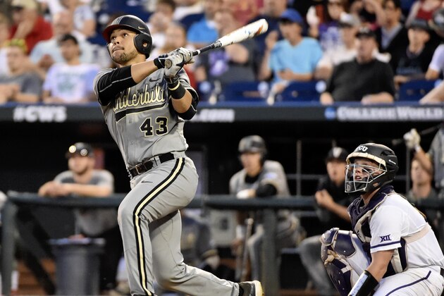 Vanderbilt's Zander Wiel (43) and TCU catcher Evan Skoug, right, follow Zander's solo home run ball in the seventh inning of an NCAA College World Series baseball game at TD Ameritrade Park in Omaha, Neb., Tuesday, June 16, 2015. (AP Photo/Mike Theiler)