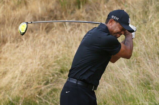 Tiger Woods reacts to his tee shot on the eighth hole during the first round of the U.S. Open golf tournament at Chambers Bay on Thursday, June 18, 2015 in University Place, Wash. (AP Photo/Matt York)