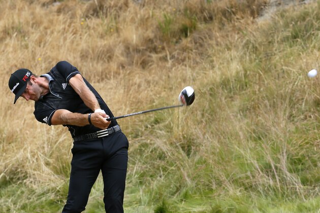 Dustin Johnson hits his tee shot on the eighth hole during the first round of the U.S. Open golf tournament at Chambers Bay on Thursday, June 18, 2015 in University Place, Wash. (AP Photo/Matt York)