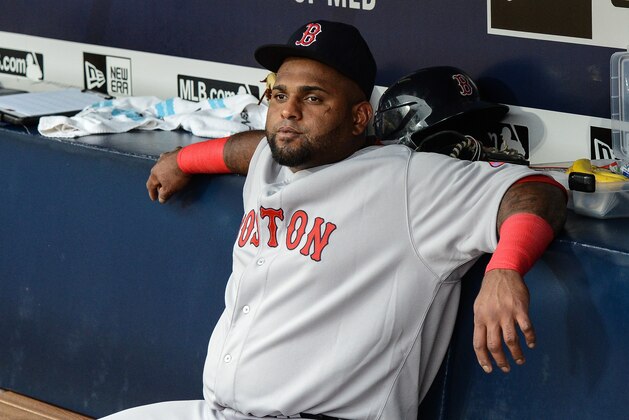 Boston Red Sox third baseman Pablo Sandoval (48) sits on the bench before the start of a baseball game against the Atlanta Braves Thursday, June 18, 2015, in Atlanta. Boston third baseman Pablo Sandoval has been benched by manager John Farrell after using his Instagram account during a loss to the Braves on Wednesday. (AP Photo/Jon Barash)