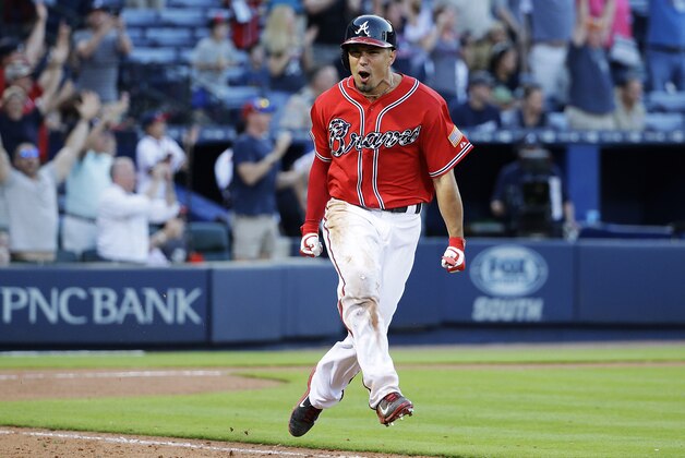 Atlanta Braves' Jace Peterson celebrates after hitting the game-winning single to score teammate Alberto Callaspo in the eleventh inning of a baseball game against the Milwaukee Brewers Saturday, May 23, 2015, in Atlanta. The Braves won 3-2. (AP Photo/David Goldman)