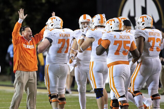 Tennessee head coach Butch Jones instructs his players in the fourth quarter of an NCAA college football game against Vanderbilt Saturday, Nov. 29, 2014, in Nashville, Tenn. Tennessee won 24-17. (AP Photo/Mark Humphrey)