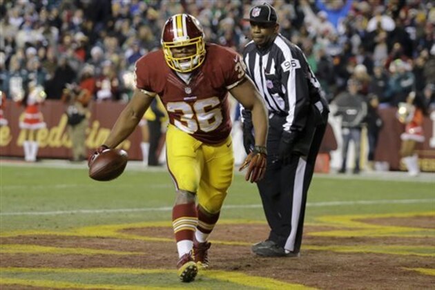 RETRANSMISSION TO CORRECT ID TO DARRELL YOUNG - Washington Redskins fullback Darrell Young (36) celebrates his touchdown during the second half of an NFL football game against the Philadelphia Eagles in Landover, Md., Saturday, Dec. 20, 2014. (AP Photo/Patrick Semansky)