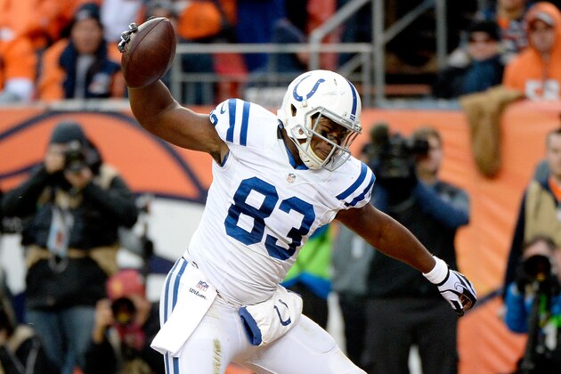 DENVER, CO - JANUARY 11:  Dwayne Allen #83 of the Indianapolis Colts celebrates a second quarter touchdown against the Denver Broncos  during a 2015 AFC Divisional Playoff game at Sports Authority Field at Mile High on January 11, 2015 in Denver, Colorado.  (Photo by Harry How/Getty Images)