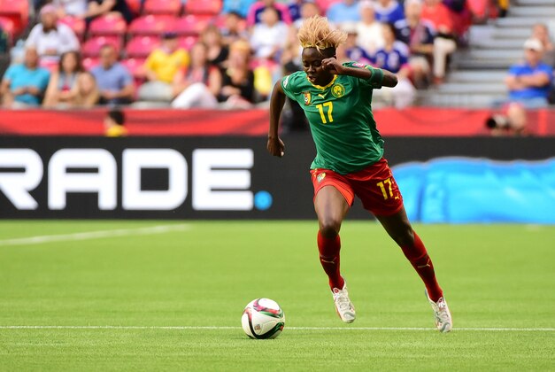 Jun 12, 2015; Vancouver, British Columbia, CAN; Cameroon forward Gaelle Enganamouit (17) dribbles the ball during the first half against Japan in a Group C soccer match in the 2015 FIFA women's World Cup at BC Place Stadium. Mandatory Credit: Anne-Marie Sorvin-USA TODAY Sports