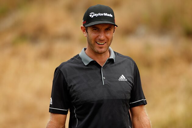 UNIVERSITY PLACE, WA - JUNE 18:  Dustin Johnson of the United States smiles after he walks off the eighth hole tee during the first round of the 115th U.S. Open Championship at Chambers Bay on June 18, 2015 in University Place, Washington.  (Photo by Ezra Shaw/Getty Images)