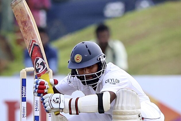 Sri Lanka’s Kaushal Silva ducks under a bouncer during the second day of the first test cricket match against Pakistan in Galle, Sri Lanka, Thursday, June 18, 2015. The entire first day's play was washed out by rain. (AP Photo/Sanka Gayashan)