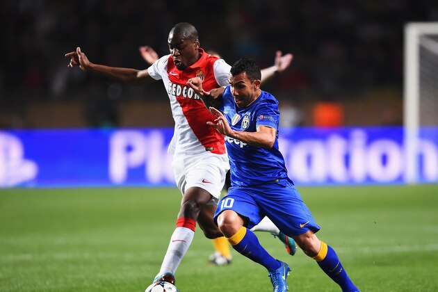 MONACO - APRIL 22: Carlos Tevez of Juventus takes on Geoffrey Kondogbia of Monaco during the UEFA Champions League quarter-final second leg match between AS Monaco FC and Juventus at Stade Louis II on April 22, 2015 in Monaco, Monaco.  (Photo by Laurence Griffiths/Getty Images)