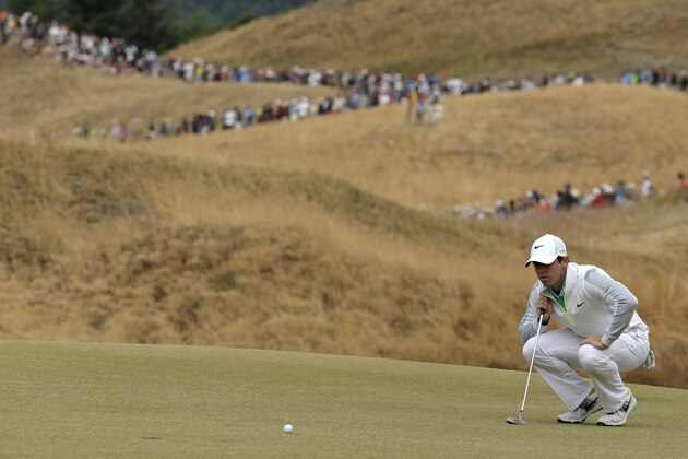 Rory McIlroy, of Northern Ireland, lines up his putt on the 13th hole during the first round of the U.S. Open golf tournament at Chambers Bay on Thursday, June 18, 2015 in University Place, Wash. (AP Photo/Charlie Riedel)