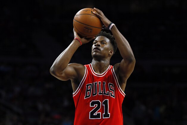 Chicago Bulls guard Jimmy Butler (21) shoots against the Detroit Pistons in the second half of an NBA basketball game in Auburn Hills, Mich., Friday, Feb. 20, 2015. (AP Photo/Paul Sancya)