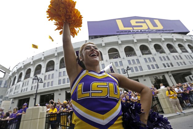 LSU cheerleaders perform to the crowd outside Tiger Stadium before an NCAA college football game against Louisiana Monroe in Baton Rouge, La., Saturday, Sept. 13, 2014. (AP Photo/Gerald Herbert)