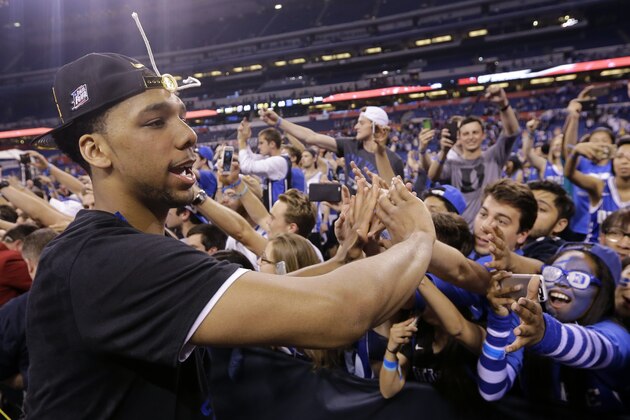 Duke's Jahlil Okafor celebrates with fans after his team's 68-63 victory over Wisconsin in the NCAA Final Four college basketball tournament championship game Monday, April 6, 2015, in Indianapolis. (AP Photo/David J. Phillip)