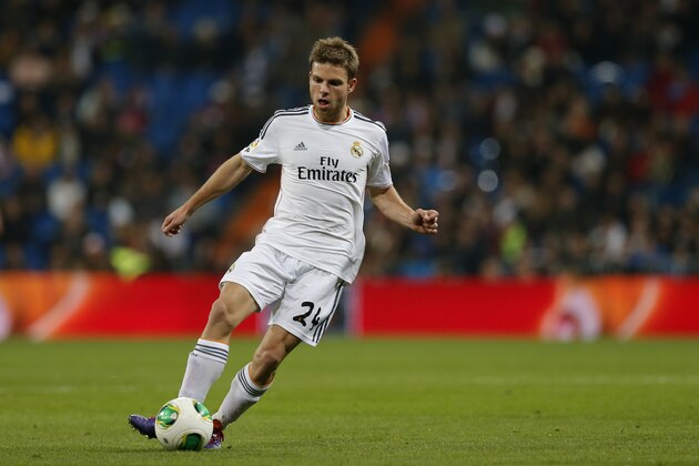 Real's Asier Illarramendi controls the ball during a Copa del Rey soccer match between Real Madrid and third-division club Xativa Olimpic at the Bernabeu stadium in Madrid, Wednesday Dec. 2013. (AP Photo/Paul White)