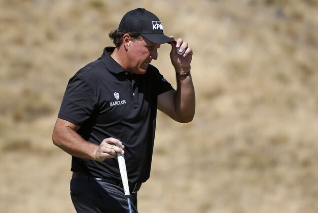 Phil Mickelson walks off the 15th green during the second round of the U.S. Open golf tournament at Chambers Bay on Friday, June 19, 2015 in University Place, Wash. (AP Photo/Lenny Ignelzi)