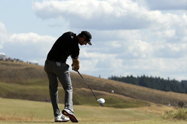 Dustin Johnson watches his tee shot on the eighth hole during the second round of the U.S. Open golf tournament at Chambers Bay on Friday, June 19, 2015 in University Place, Wash. (AP Photo/Charlie Riedel)