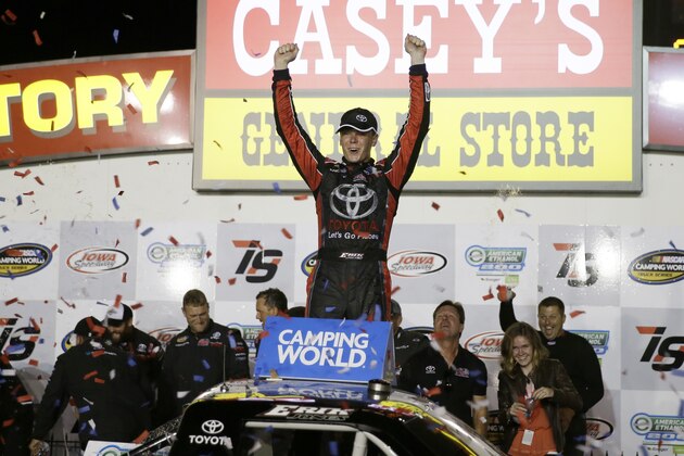 Erik Jones celebrates in Victory Lane after winning the NASCAR Truck Series auto race, Friday, June 19, 2015, at Iowa Speedway in Newton, Iowa. (AP Photo/Charlie Neibergall)