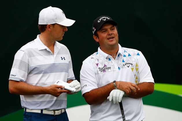 SCOTTSDALE, AZ - JANUARY 29: Patrick Reed talks with Jordan Spieth on the 16th green during the first round of the Waste Management Phoenix Open at TPC Scottsdale on January 29, 2015 in Scottsdale, Arizona.  (Photo by Sam Greenwood/Getty Images)