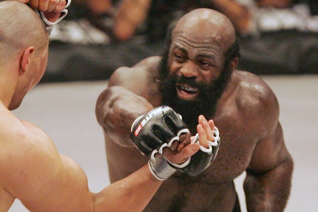 FILE - In this May 31, 2008, file photo, fighter Kimbo Slice, right, throws a punch at James Thompson of Manchester, England during the second round of their EliteXC heavyweight mixed-martial arts bout at the Prudential Center in Newark, N.J. Slice could have faded into wealthy obscurity after earning a fortune and becoming the biggest name in mixed martial arts a few years ago. Instead, the former strip-club bouncer dedicated himself to learning the sport's finer points, and he hopes to show off his progress at UFC 113 this weekend. (AP Photo/Rich Schultz, File)