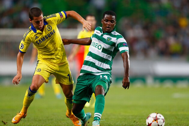 LISBON, PORTUGAL - SEPTEMBER 30:  William Carvalho of Sporting Lisbon battles with Eden Hazard of Chelsea during the UEFA Champions League Group G match between Sporting Clube de Portugal and Chelsea FC at Estadio Jose Alvalade on September 30, 2014 in Lisbon, Portugal.  (Photo by Julian Finney/Getty Images)
