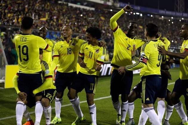 Colombia players celebrate after scoring the opening goal during a Copa America Group C soccer match against Brazil at the Monumental stadium in Santiago, Chile, Wednesday, June 17, 2015. (AP Photo/Natacha Pisarenko)