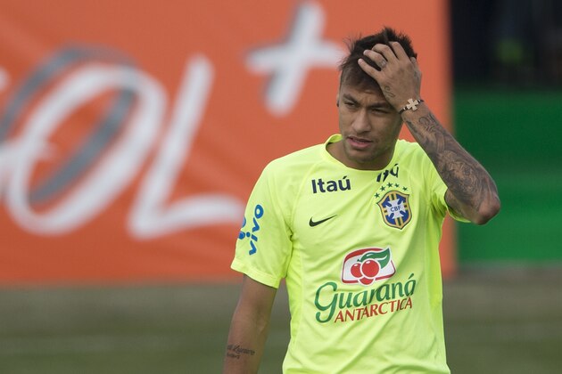 Brazil's soccer player Neymar gestures during a team training session in Santiago, Chile, Friday, June 19, 2015. Brazil will face Venezuela in a Copa America soccer match Sunday. (AP Photo/Silvia Izquierdo)