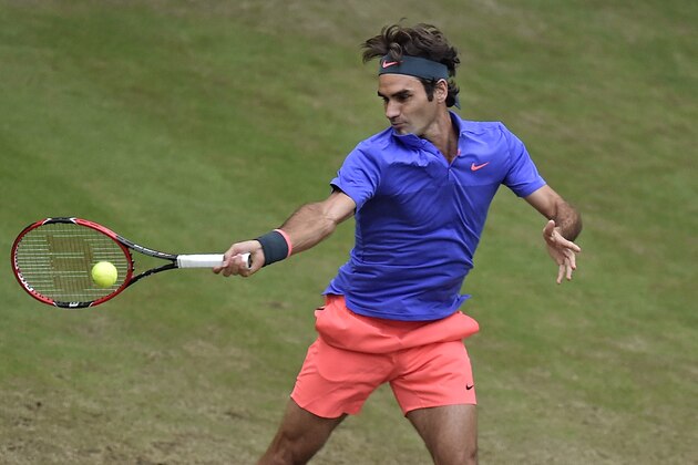 Roger Federer of Switzerland returns the ball to Florian Mayer of Germany during their quarterfinal match at the Gerry Weber Open ATP tennis tournament in Halle, Germany, Friday, June 19, 2015. (AP Photo/Martin Meissner) Roger Federer of Switzerland returns the ball to Florian Mayer of Germany during their quarterfinal match at the Gerry Weber Open ATP tennis tournament in Halle, Germany, Friday, June 19, 2015. (AP Photo/Martin Meissner)