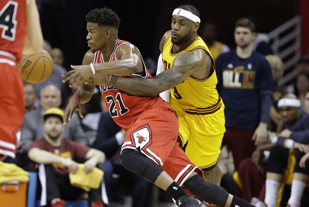 Cleveland Cavaliers forward LeBron James (23) tries to pick the ball from Chicago Bulls guard Jimmy Butler (21) during the second half of Game 2 in a second-round NBA basketball playoff series Wednesday, May 6, 2015, in Cleveland. (AP Photo/Tony Dejak)
